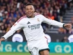 Real Madrid's French forward #10 Kylian Mbappe celebrates.
