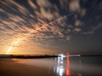 FILE PHOTO: The SpaceX Falcon 9 rocket carrying Starlink satellites is seen over Sebastian Inlet after launching from Cape Canaveral, Florida, U.S., February 26, 2025.