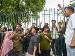 Students of Jamia Millia Islamia protesting outside university gate on Sunday. 