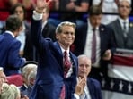 Treasury Secretary Scott Bessent waves as President Donald Trump speaks during a campaign rally, Friday, Oct. 23, 2026, at Alico Arena on the campus of Florida Gulf Coast University in Fort Myers, Fla. (AP Photo/Chris O'Meara)