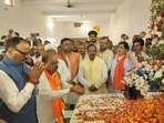 Uttar Pradesh deputy CM Brajesh Pathak paying tribute to former MLA Bala Prasad Awasthi in Lakhimpur Kheri on October 26. (HT photo)