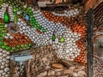 Thousands of glass bottles, set in rock and mortar, form the walls of this Tucson home.(@tucsonbottlehouse/Instagram)