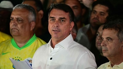 Flavio Bolsonaro reacts after knowing the first results in the presidential runoff election, in Brasilia. (AFP) Flavio Bolsonaro reacts after knowing the first results in the presidential runoff election, in Brasilia. (AFP)