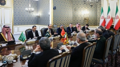  Ibrahim Kalin, the head of Turkey's intelligence service, rear third left, speaks in a meeting of high-level delegations from Saudi Arabia, Pakistan and Turkey with Iranian President Masoud Pezeshkian, front second left, and other top Iranian officials in Tehran, Iran, Monday, Oct. 26, 2026