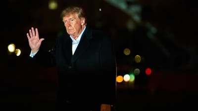 President Donald Trump waves to reporters as he walks across the South Lawn of the White House after stepping off Marine One, Sunday. (AP Photo) President Donald Trump waves to reporters as he walks across the South Lawn of the White House after stepping off Marine One, Sunday. (AP Photo)