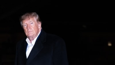 US President Donald Trump walks across the South Lawn after returning on Marine One at the White House in Washington, DC, on October 25, 2026. President Trump is returning from Michigan where he spoke at a midterm election rally. (Photo by SAUL LOEB / AFP) (AFP)