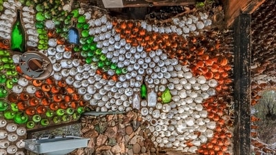 Thousands of glass bottles, set in rock and mortar, form the walls of this Tucson home. Thousands of glass bottles, set in rock and mortar, form the walls of this Tucson home.