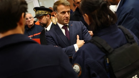 French President Emmanuel Macron meets police officers and rescue forces at the town hall in Trappes, near Paris, France, Friday Oct. 23, 2026, after a shooting in the Parisian suburb left one person dead and several others wounded. AP/PTI(AP10_24_2026_000007B) (AP)