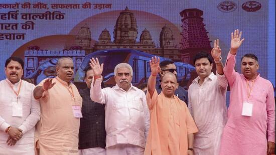 Chief minister Yogi Adityanath and others during the inauguration of projects in Kanpur on Monday. (PTI PHOTO)