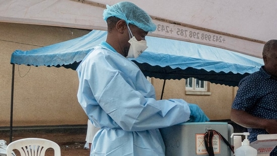 Health workers and humanitarian responders on the front lines of the Ebola response gather to receive a vaccination due to their potential exposure to the virus as part of their work with suspected cases. 