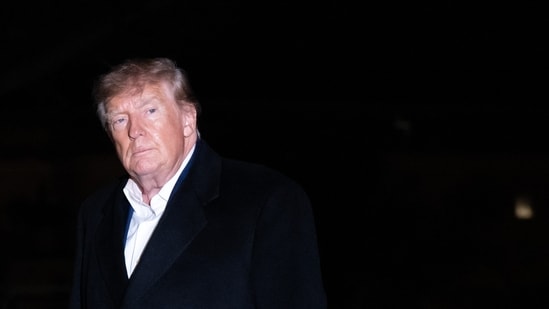 US President Donald Trump walks across the South Lawn after returning on Marine One at the White House in Washington, DC, on October 25, 2026. President Trump is returning from Michigan where he spoke at a midterm election rally. (Photo by SAUL LOEB / AFP) (AFP)