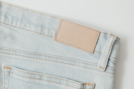 First used to identify hard-wearing work trousers, the jeans patch became a familiar symbol of brand identity and denim heritage. (Pexels)