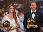 England's soccer player Harry Kane and Spain's Alexia Putellas win the player of the year trophy during the Ballon d'Or ceremony at the London Palladium Theatre in London, England, Monday, Oct. 26