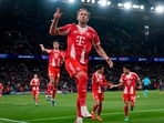 Bayern's Harry Kane celebrates after scoring a penalty, the opening goal of his team during the Champions League semifinal first leg soccer match between Paris Saint-Germain and Bayern Munich in Paris