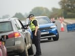 Police officers stand at a checkpoint near RAF Fairford air base, in Fairford, England, on September 29, 2026. (File Photo/AP)