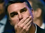 Flávio Bolsonaro faces mounting legal pressure after refusing to concede defeat, while authorities remain uncertain about his whereabouts. (Photo by Evaristo Sa / AFP)(AFP)