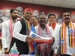 Former IAS officer and others joined the Samajwadi Party in the presence of Akhilesh Yadav in Lucknow on Monday (HT Photo)