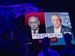 Images of Israeli Prime Minister Benjamin Netanyahu and Gadi Eisenkot, leader of Yashar, displayed on screens during a final election campaign rally in Tel Aviv, Israel, on Sunday, Oct. 25.(Bloomberg)