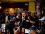 Israeli Prime Minister Benjamin Netanyahu, leader of the Likud party, speaks to supporters during a visit to Jerusalem's Mahane Yehuda Market as part of his election campaign early Friday