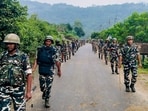 Arunachal Pradesh Police and CRPF personnel conduct a flag march amid tensions over the proposed Siang Multipurpose Hydroelectric Project, at Geku, in Upper Siang district,(PTI)