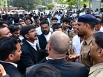 Police trying to pacify agitating lawyers at Modical College crossing in Prayagraj on Monday afternoon. (Anil Kumar Maurya/ht photo)