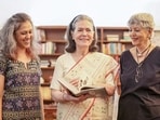 Congress chairperson Sonia Gandhi poses for a group picture with her upcoming book, ‘Belonging: A Journey of Love’, in New Delhi, India, on Thursday, October 22, 2026. 