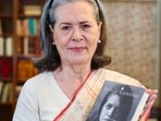 New Delhi, India - Oct. 22, 2026: Congress chairperson Sonia Gandhi poses for a picture with her upcoming book, ‘Belonging: A Journey of Love’, in New Delhi, India, on Thursday, October 22, 2026.  (@INCIndia X / HT Photo)