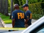 Members of the FBI are seen outside a home tied in an investigation in to U.S. Rep. Eric Swalwell (D-CA) on October 27, 2026 in Beverly Hills, California.(Getty Images via AFP)