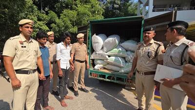 Gurugram police with the seized contraband. (HT Photo)