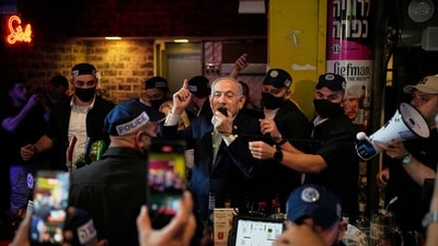 Israeli Prime Minister Benjamin Netanyahu, leader of the Likud party, speaks to supporters during a visit to Jerusalem's Mahane Yehuda Market as part of his election campaign early Friday (AP Photo/Ohad Zwigenberg) Israeli Prime Minister Benjamin Netanyahu, leader of the Likud party, speaks to supporters during a visit to Jerusalem's Mahane Yehuda Market as part of his election campaign early Friday (AP Photo/Ohad Zwigenberg)