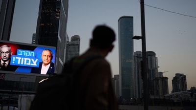 A pedestrian passes a billboard in Tel Aviv, Israel. (AP Photo) A pedestrian passes a billboard in Tel Aviv, Israel. (AP Photo)