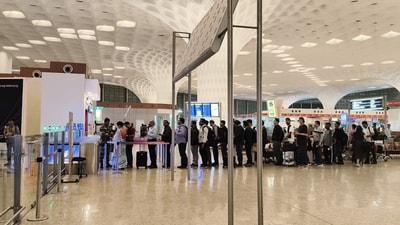 Passengers waiting near the e gates when it was not operational. CISF allowed each passenger manually.