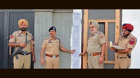 Police officials outside the house of the drug offender at Salempura Tibba on Tuesday. (HT)
