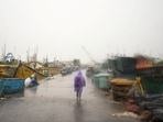 Cyclone Arnab landfall news LIVE: A man walks past docked boats along the harbour amid rain and gusty winds as Cyclone Arnab approaches in Visakhapatnam, Andhra Pradesh.