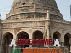 Adam Khan’s tomb rose above Mehrauli’s bus adda, its façade visible against the sky. Then, a few weeks ago, a large sign appeared before it. “WELCOME,” it said, followed by “JAI MEHRAULI.” (HT Photo)