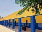 Government school buildings painted in shades of yellow and blue in Ludhiana on Tuesday. (HT Photo)