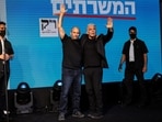 Former Prime Ministers Naftali Bennett and Yair Lapid gesture following exit polls in Tel Aviv, Israel.