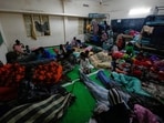 People gather at a temporary shelter set up inside a school as Cyclone Arnab approaches the Andhra Pradesh coast in Kakinada, India.