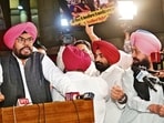 Leader of the Opposition Partap Singh Bajwa and other Congress MLAs get into a heated exchange during a media interaction during the Punjab Assembly session in Chandigarh on Tuesday. (HT Photo)