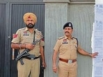 Police officials outside the house of the drug offender at Salempura Tibba on Tuesday. (HT)