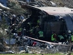 Rescue personnel work at the site of the collision of two high-speed trains between the towns of Mora and Orgaz, near Toledo, Spain, October 28, 2026. 