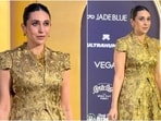 Karisma Kapoor dazzles in a gold brocade outfit. 