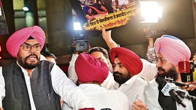 Leader of the Opposition Partap Singh Bajwa and other Congress MLAs get into a heated exchange during a media interaction during the Punjab Assembly session in Chandigarh on Tuesday. (HT Photo) Leader of the Opposition Partap Singh Bajwa and other Congress MLAs get into a heated exchange during a media interaction during the Punjab Assembly session in Chandigarh on Tuesday. (HT Photo)