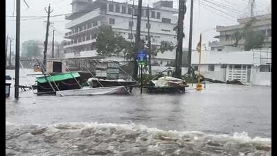 Roadside stalls lie overturned and partially submerged on a severely flooded street following heavy downpours and strong winds triggered by Cyclone Arnab at Machilipatnam, in Krishna on Wednesday. (ANI Video Grab)