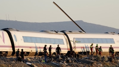 Rescue personnel work at the site of the collision of two high-speed trains between the towns of Mora and Orgaz, near Toledo, Spain, October 28, 2026. 