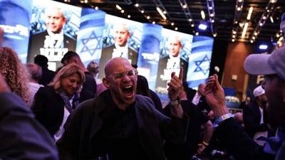 Supporters of Likud party leader and Israel's Prime Minister Benjamin Netanyahu celebrate at the International Convention Centre in Jerusalem early on October 28, 2026. (AFP) Supporters of Likud party leader and Israel's Prime Minister Benjamin Netanyahu celebrate at the International Convention Centre in Jerusalem early on October 28, 2026. (AFP)