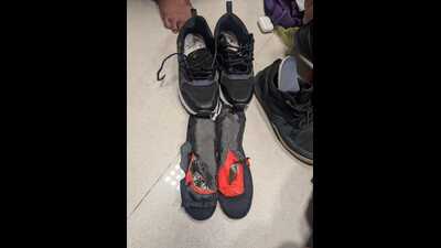 officials became suspicious after noticing that the black sports shoes he was wearing had unusually thick soles and appeared heavier than normal. (HT) officials became suspicious after noticing that the black sports shoes he was wearing had unusually thick soles and appeared heavier than normal. (HT)
