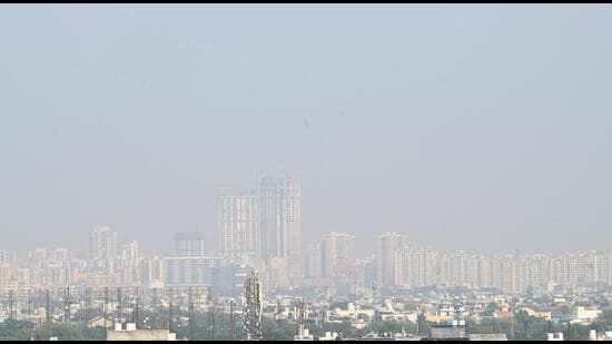 A view of skyscrapers in Noida city, shrouded in pollution in the afternoon on Wednesday. (Sunil Ghosh/HT Photo)