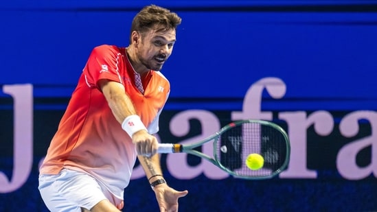 Switzerland's Stan Wawrinka returns a shot to Czech Republic's Jiri Lehecka during the first round of the Swiss Indoors tennis tournament in Basel