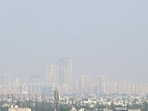 A view of skyscrapers in Noida city, shrouded in pollution in the afternoon on Wednesday. (Sunil Ghosh/HT Photo)